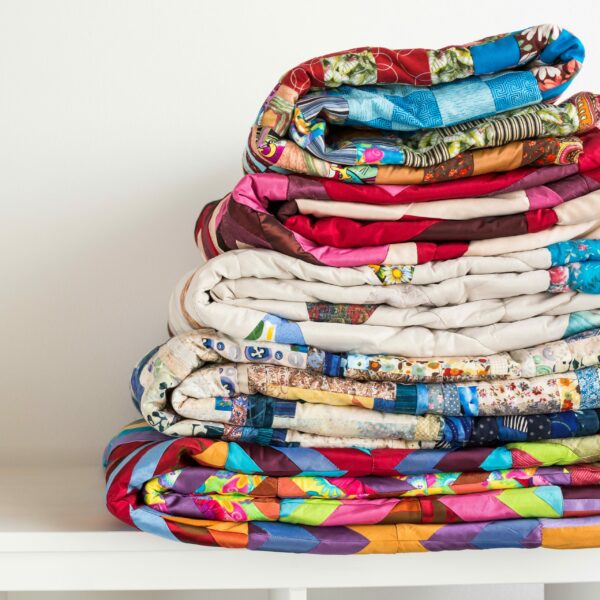 Sewing,And,Fashion,Concept,-,Stack,Of,Colorful,Quilts,,Beautiful